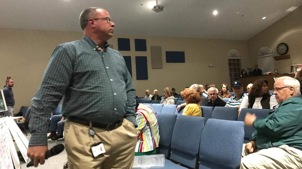 Traffic engineer Keith Slater (center) found himself on the hot seat Thursday night as he explained the Florida Department of Transportation’s plans to the community for improving safety at the intersection of U.S. 301 and C.R. 675 in Parrish.