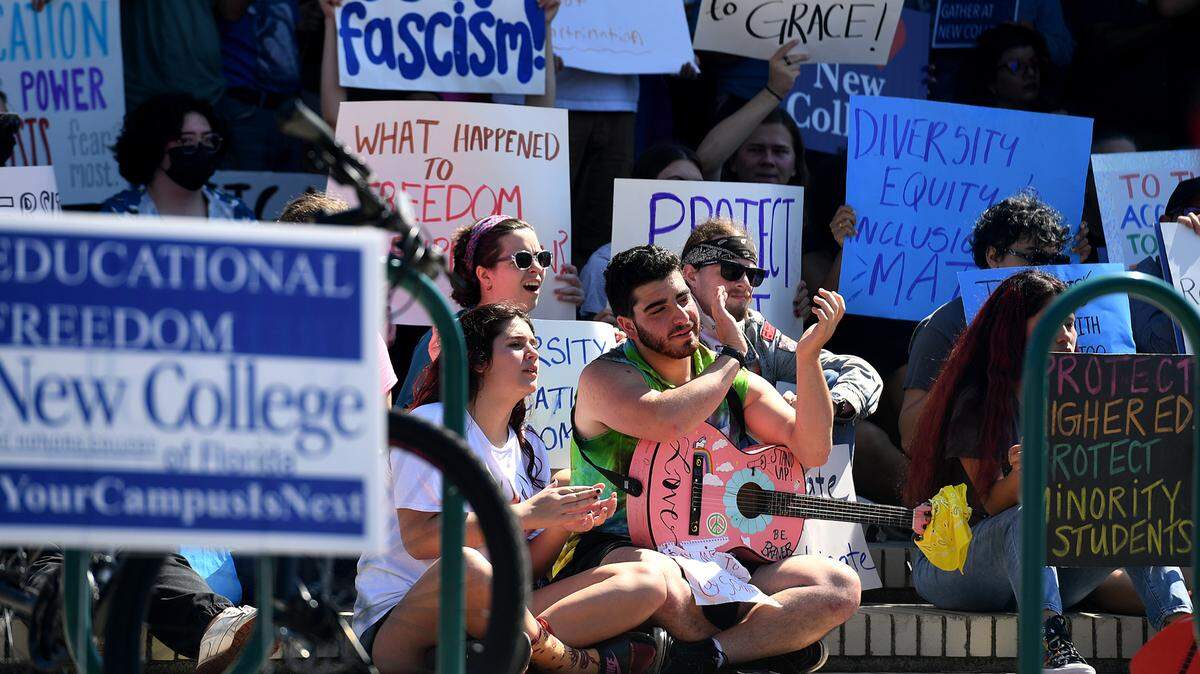 Students, faculty and alumni gathered near the Sudakoff Center at New College on Feb. 28 before a meeting of the new board of trustees to make passionate speeches; they shared their experiences and hopes for an inclusive and diverse student body to continue.