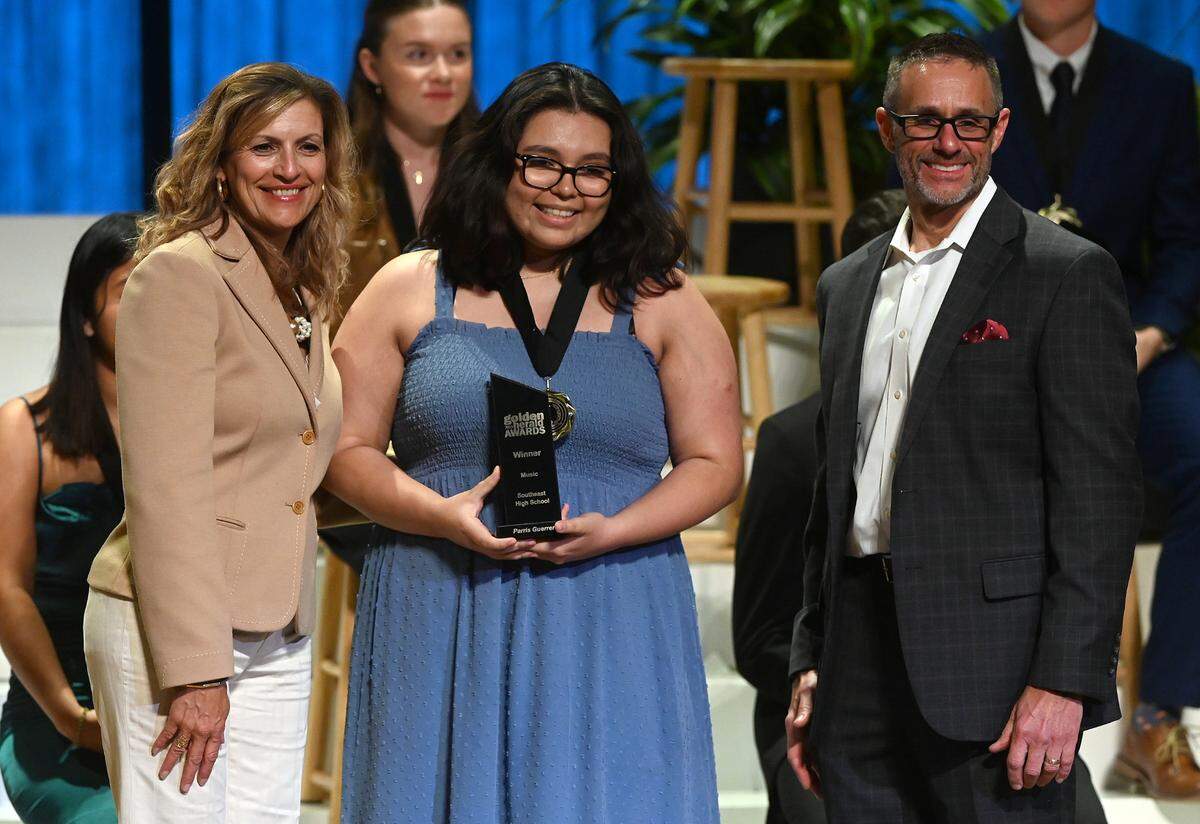 2023 Golden Herald Award winner for Music Paris Guerrero with presenters Jackie Barron and Tom McDougal Thursday night.
