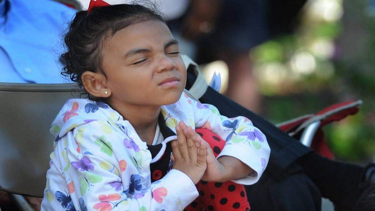 Arionna Waiters, 5, prays during the 2015 National Day of Prayer event at Palmetto's Historical Park. Thursday, May 5, marks this year's National Day of Prayer with Palmetto celebrating at the park beginning at 9 a.m. Manatee County and Bradenton will celebrate at the Manatee County Courthouse beginning at 11:45 a.m. GRANT JEFFERIES/Bradenton Herald file photo