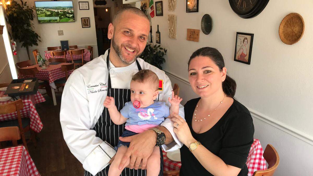 Nicola and Maria Simone are shown with their daughter, Alice, 6 months, in their new A Casa Tua restaurant location at 8799 Cortez Road.