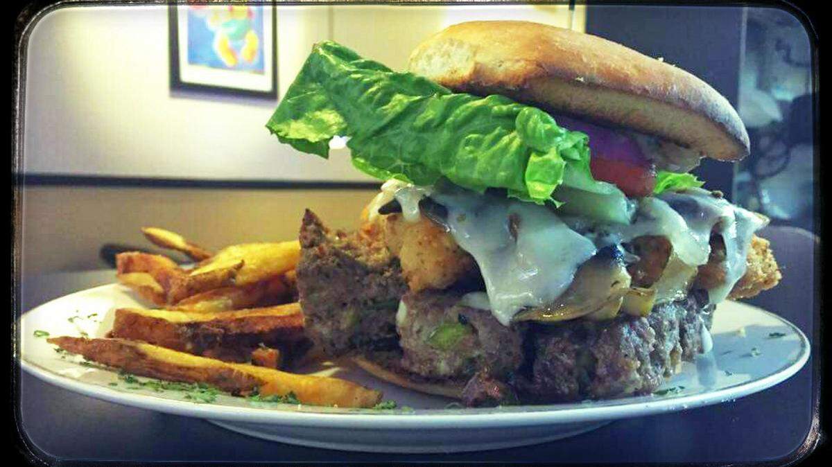 4 Hounds Grill, 5408 26th St. W., Bradenton, is known for its pizza, pasta and large sandwiches including the Barn Yard Burger, which features housemade meat loaf topped with a fried chicken breast, grilled onions, mushrooms and cheese served on our fresh bread. 
 PHOTO PROVIDED