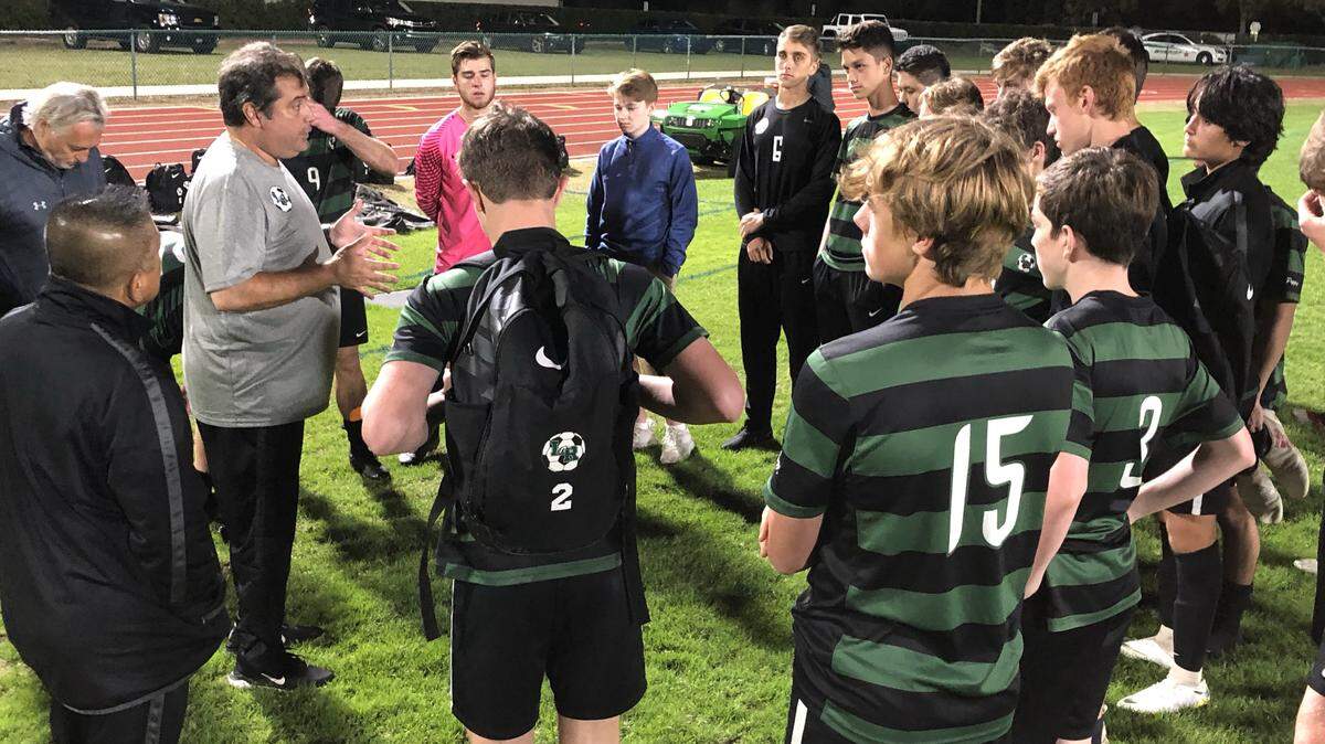 Lakewood Ranch head coach Vito Bavaro addresses his team after Saturday’s 2-0 loss to Lake Mary in the Class 5A boys soccer state semifinals. The Mustangs finished 20-2-2 and won their third regional title in six seasons.