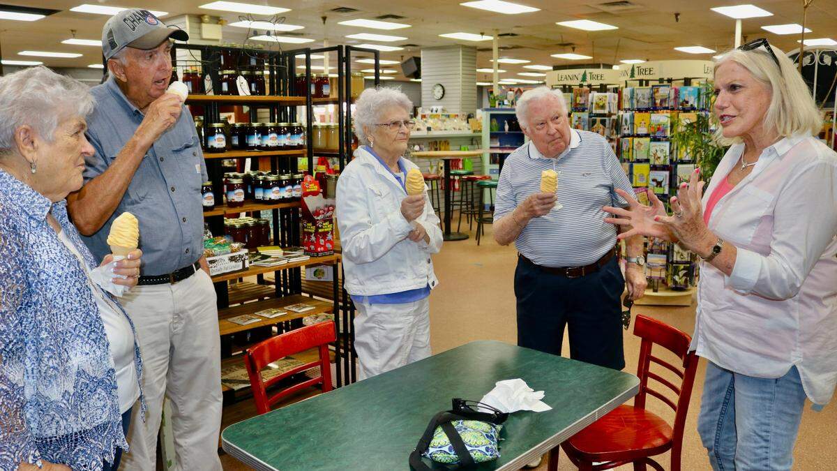 Janet Mixon, co-owner of Mixon Fruit Farms, right, chats on April 12, 2022, with guests, from left, Sally Rolfe, Mike Rafferty, Suzanne Hohman and Tom Rolfe.