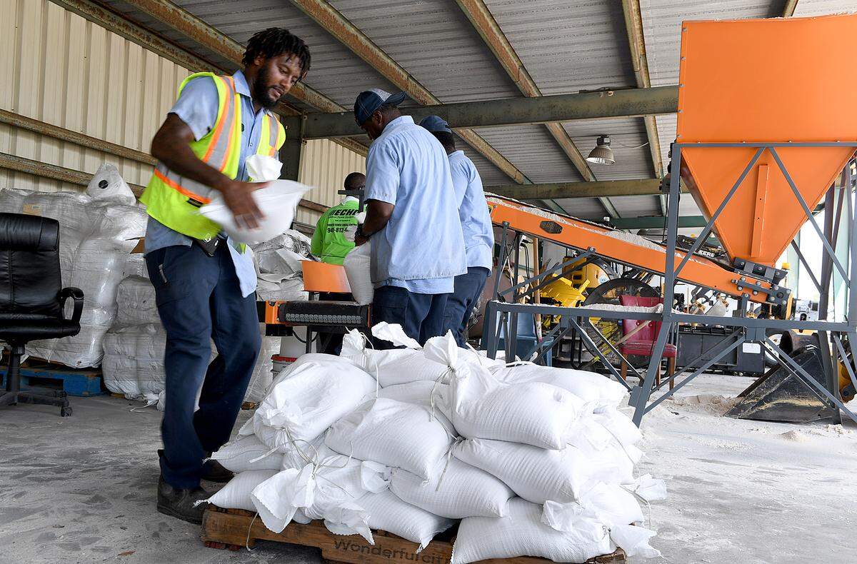 City of Bradenton employees filled pallets of sandbags at the Public Works Annex in this 2019 Bradenton Herald file photo.