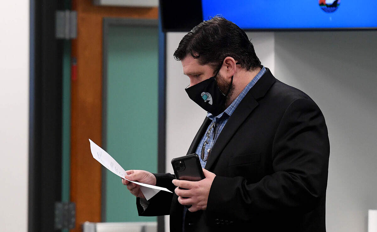 02/18/21--The Manatee County Commission may elect to cover the $60,000 costs that Commissioners James Satcher and Kevin Van Ostenbridge paid as part of a public record lawsuit. In this Bradenton Herald file photo, Commissioner James Satcher reads an FDLE subpoena after he was served ahead of a public work session meeting on Feb. 18, 2021.