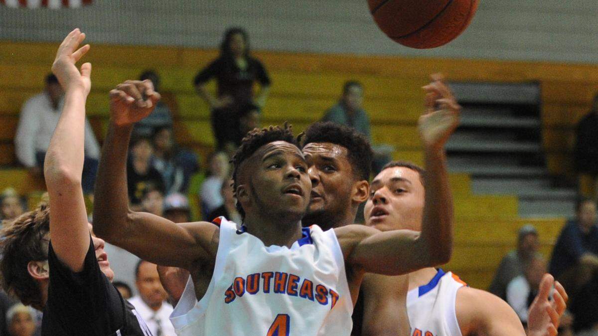 Southeast High's Keives Brooks looses his grip on the ball as he goes up for a shot during a region semifinal Tuesday at Southeast High School. 
 GRANT JEFFERIES/Bradenton Herald