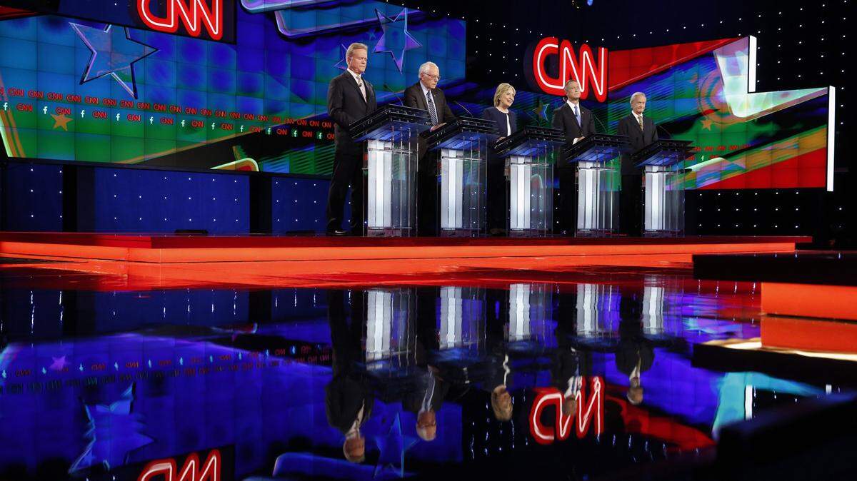 Democratic presidential candidates from left, former Virginia Sen. Jim Webb, Sen. Bernie Sanders, of Vermont, Hillary Rodham Clinton, former Maryland Gov. Martin O'Malley, and former Rhode Island Gov. Lincoln Chafee stand on stage during the CNN Democratic presidential debate Tuesday, Oct. 13, 2015, in Las Vegas. (AP Photo/John Locher)