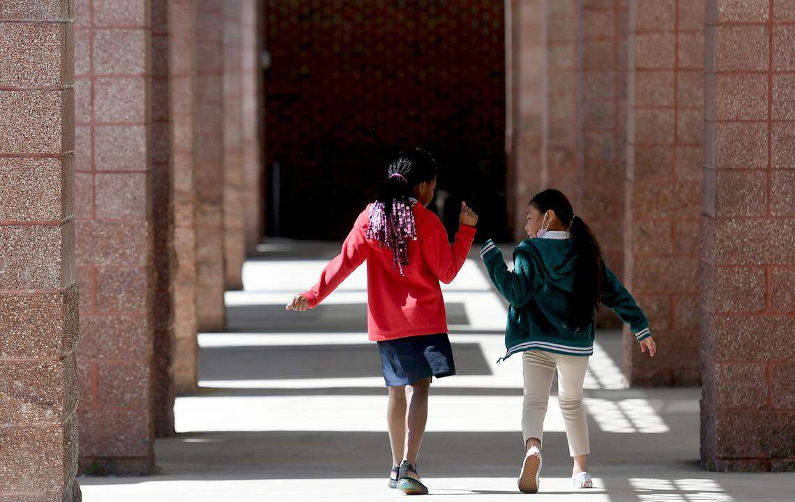 Two students of Manatee Elementary School make their way through the halls on a cool Wednesday morning. The school is a Community school, with a medical center, food pantry, and other supportive services for the students and their families.
