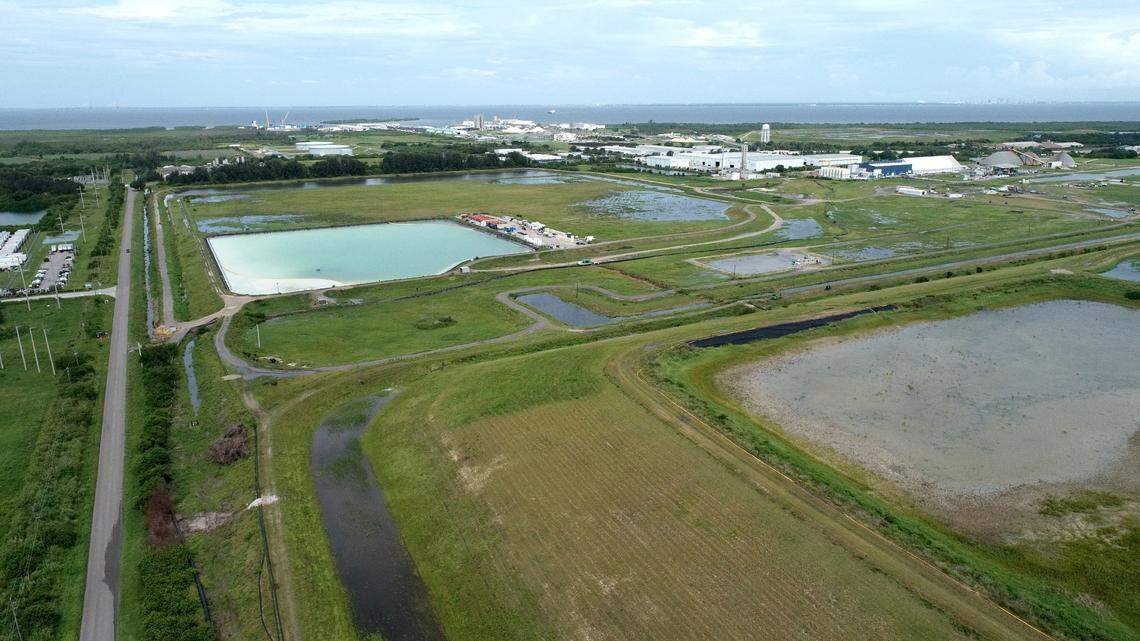 08/03/21—Recent rains have added significant amounts of water to the stacks at Piney Point. Florida’s top environmental officials have taken a step back from managing the cleanup of the troublesome Piney Point facility, according to an update from County Administrator Scott Hopes. Looking westward over the Piney Point industrial site towards Port Manatee and Tampa Bay in this drone photo.