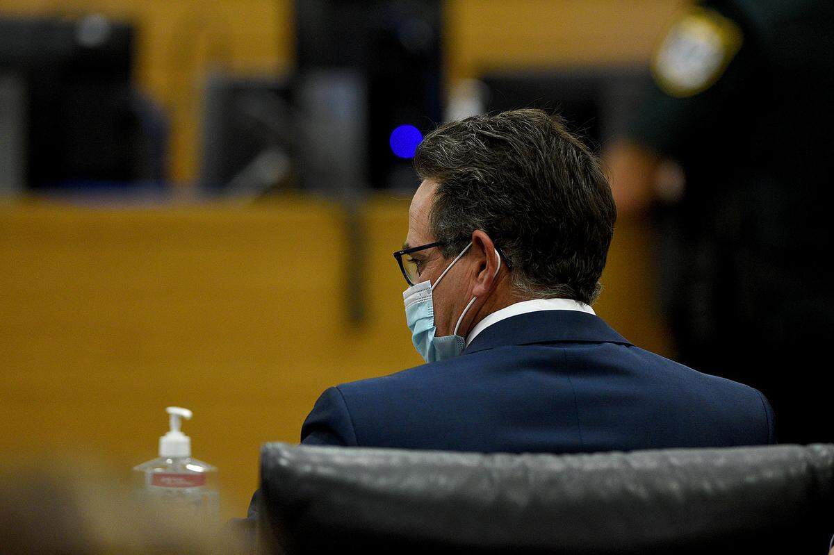 10/22/21—Defense attorney Brett McIntosh sits in the courtroom as his client, Blake Meadows, makes his first appearance before Judge Edward Nicholas via video feed from the Manatee County Jail for a charge of manslaughter in the shooting death of his wife. His bond was set at $70,000.