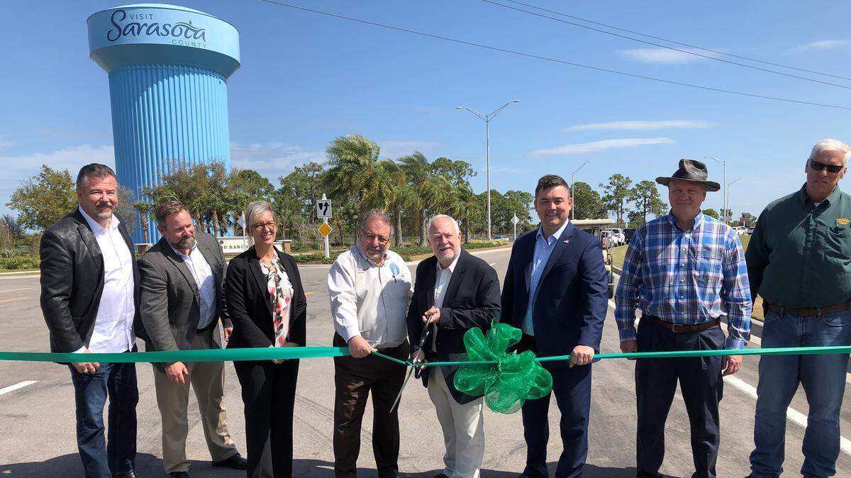 Rex Jensen, president and CEO of Schroeder-Manatee Ranch, cuts the ribbon to mark completion of Lakewood Ranch Boulevard, connecting Fruitville Road in Sarasota, and providing a north-south alternative to Interstate 75. It is now possible to drive from Parrish in the north to Sarasota without using I-75.