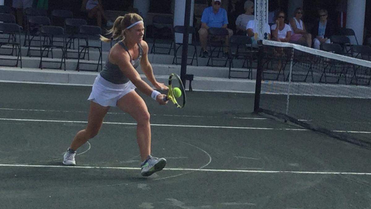 Tennis players warm up ahead of a singles match at the annual Dick Vitale Intercollegiate Clay Court Tennis Tournament in Lakewood Ranch on Saturday. Competition continues Sunday and the proceeds from the tournament will help battle the fight against cancer.