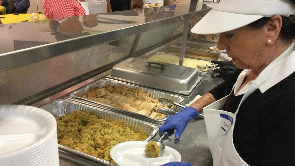Volunteers gathered at the Salvation Army on Thanksgiving to help serve up to 300 meals to the homeless and others.
