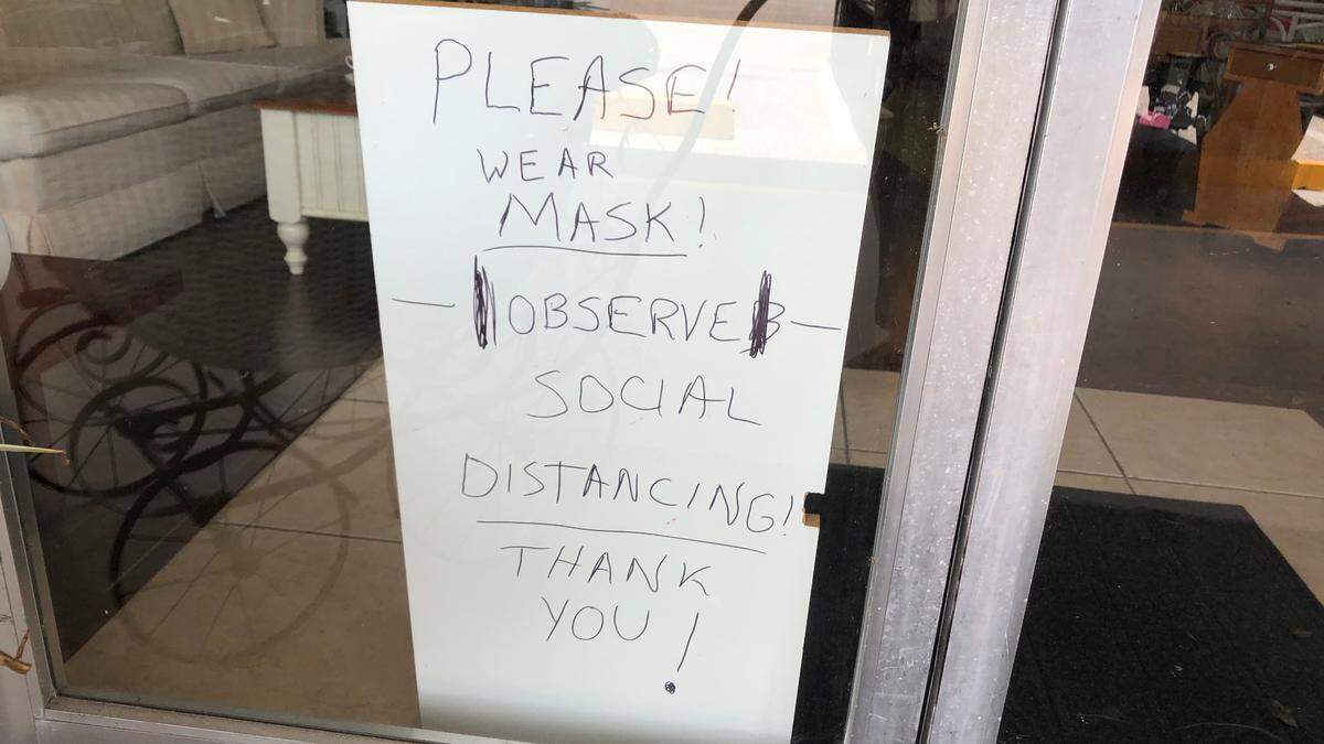 Theo and Sheryl Cajoleas, owners of What A Find! Consignment and Thrift, 5231 Manatee Ave. W., require customers to wear a mask in their store.