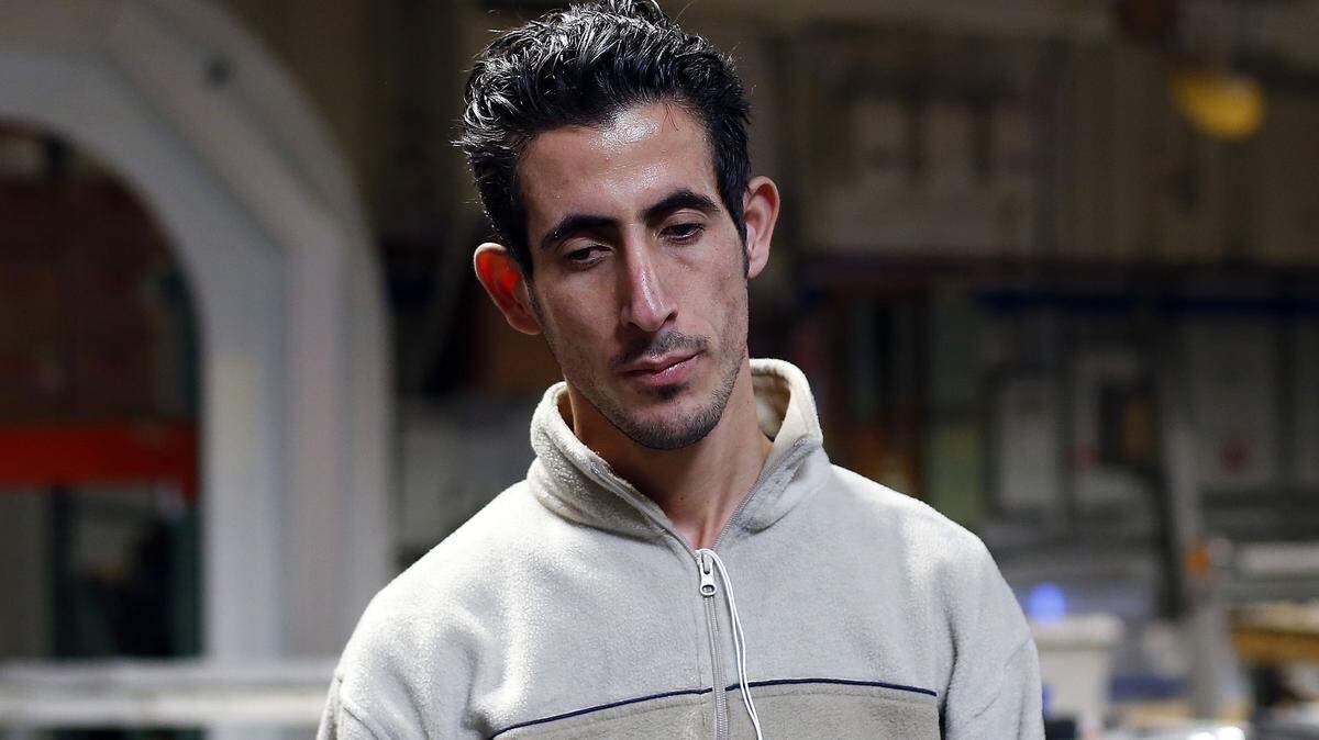 Syria refugee Nedal Al-Hayk listens during an interview Monday, Nov. 16, 2015 in Warren, Mich. Several U.S. governors are threatening to halt efforts to allow Syrian refugees into their states in the aftermath of the coordinated attacks in Paris, though an immigration expert says they have no legal authority to do so. (AP Photo/Paul Sancya)