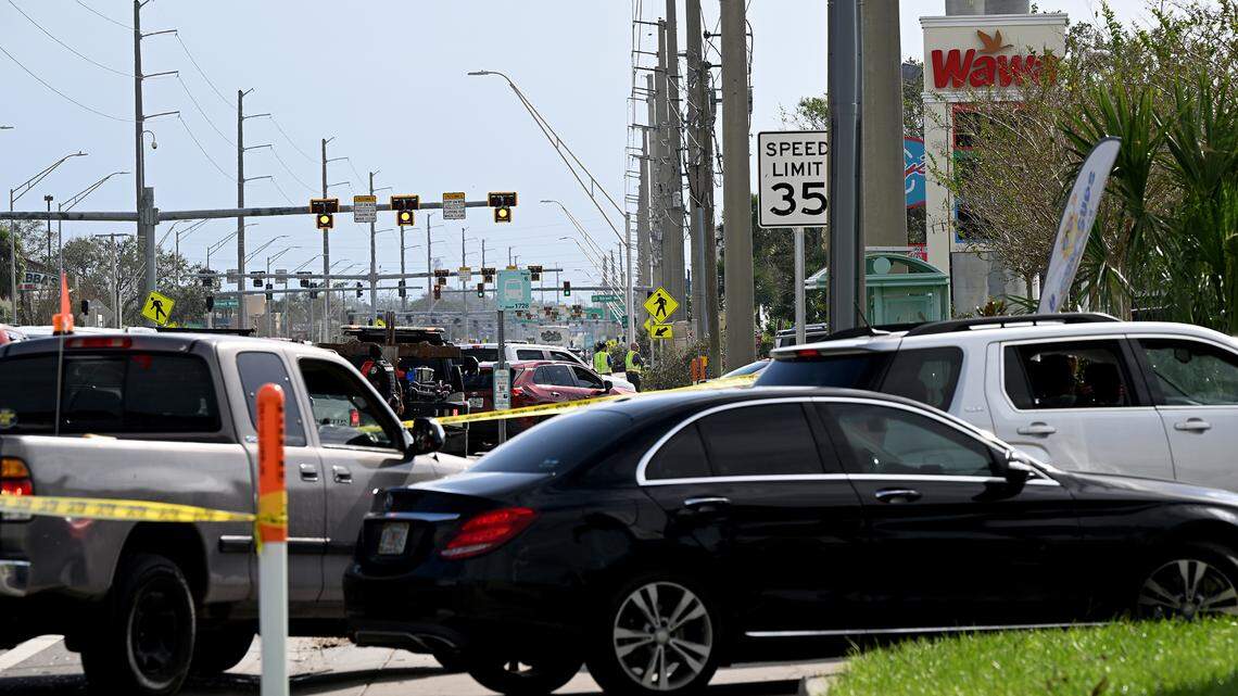A line of cars formed toward the Wawa at 2409 Cortez Road West in Manatee County, Florida, after Hurricane Milton on Oct. 11, 2024. Only two pumps seemed to be in use as deputies from the Manatee County Sheriff’s Office tried to keep motorists in line.