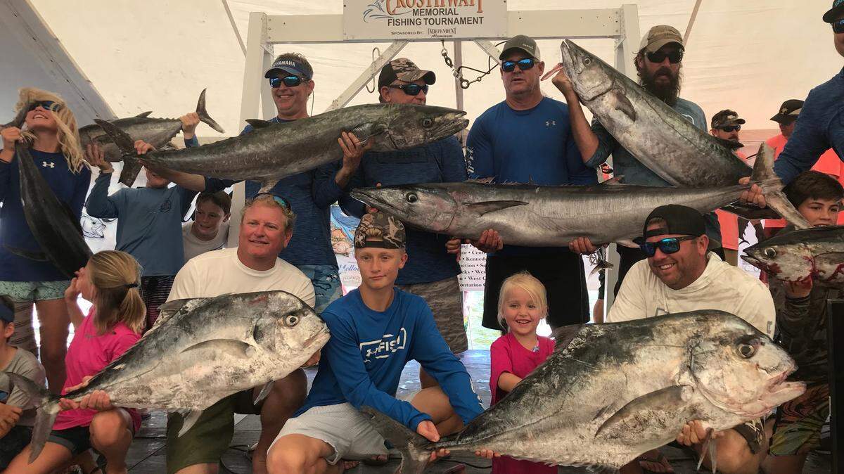 Members of team Haulin Grass show off their catch during the 2019 Crosthwait tournament weigh-in. The team captured the offshore championship.