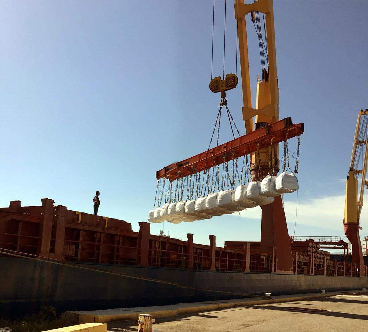 Supersacks of imported salt – each containing 63 bags weighing 40 pounds apiece – are stacked in a laydown area outside a berthside warehouse at Port Manatee.