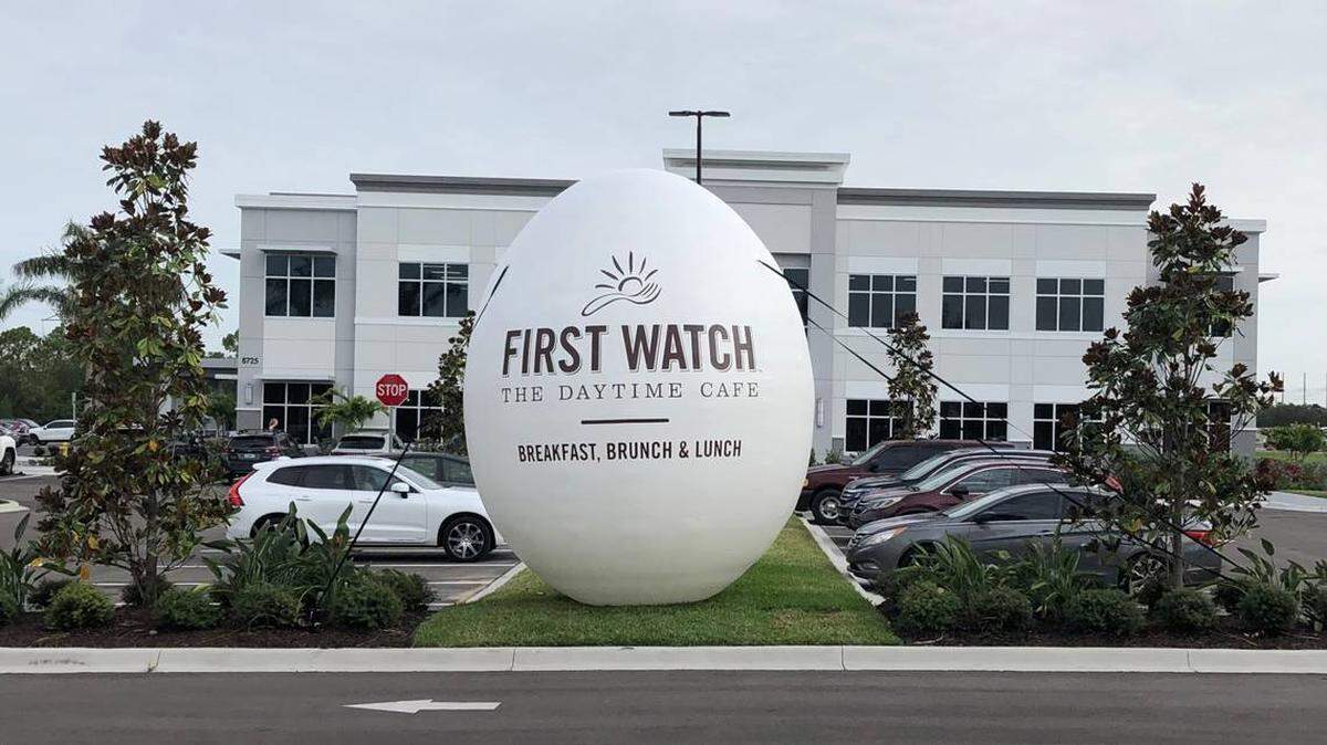 7/15/2021--In July, First Watch restaurants christened the opening of its new corporate headquarters at 8725 Pendery Place, University Place, with an egg cracking ceremony on Thursday, July 15.