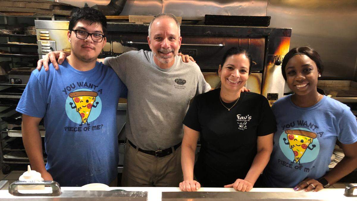 Fav’s Italian Cucina opened at 419 12th St. W. in downtown Bradenton 20 years ago. Among the staff today are, left, Eber Rebullosa, Michael Favasuli, Maria Favasuli, and Lenya Allen.