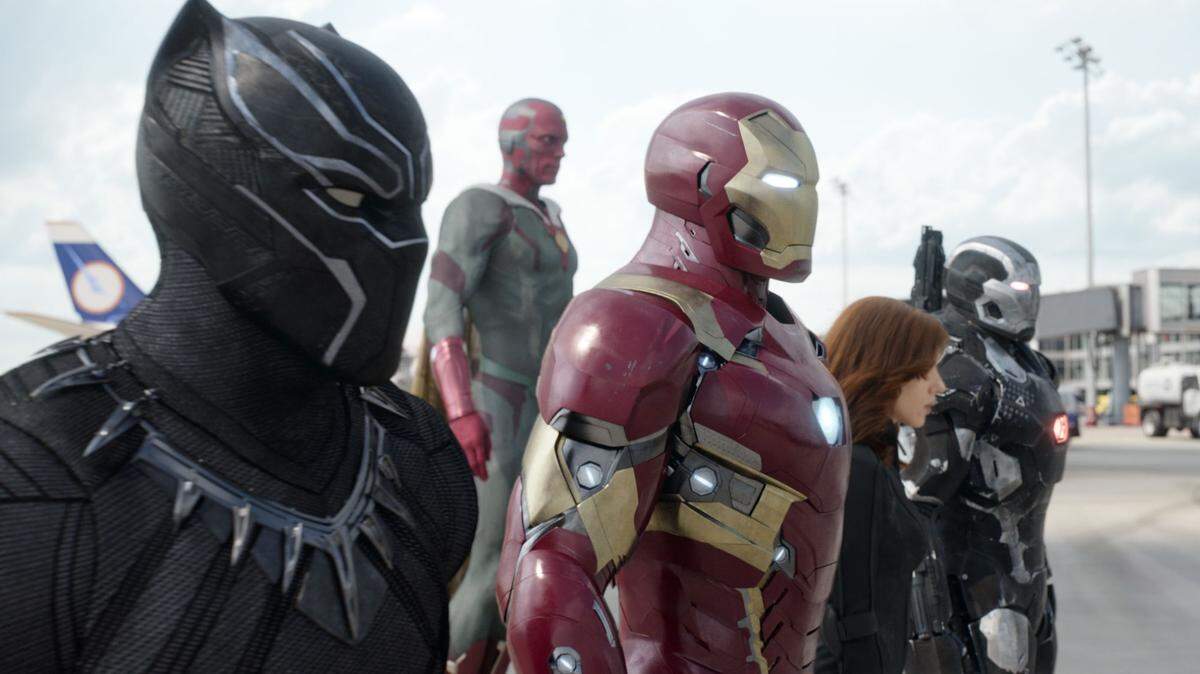 This image released by Disney shows, from left, Chadwick Boseman as Panther, Paul Bettany as Vision, Robert Downey Jr. as Iron Man, Scarlett Johansson as Natasha Romanoff, and Don Cheadle as War Machine in a scene from "Marvel's Captain America: Civil War." (Disney Marvel via AP)