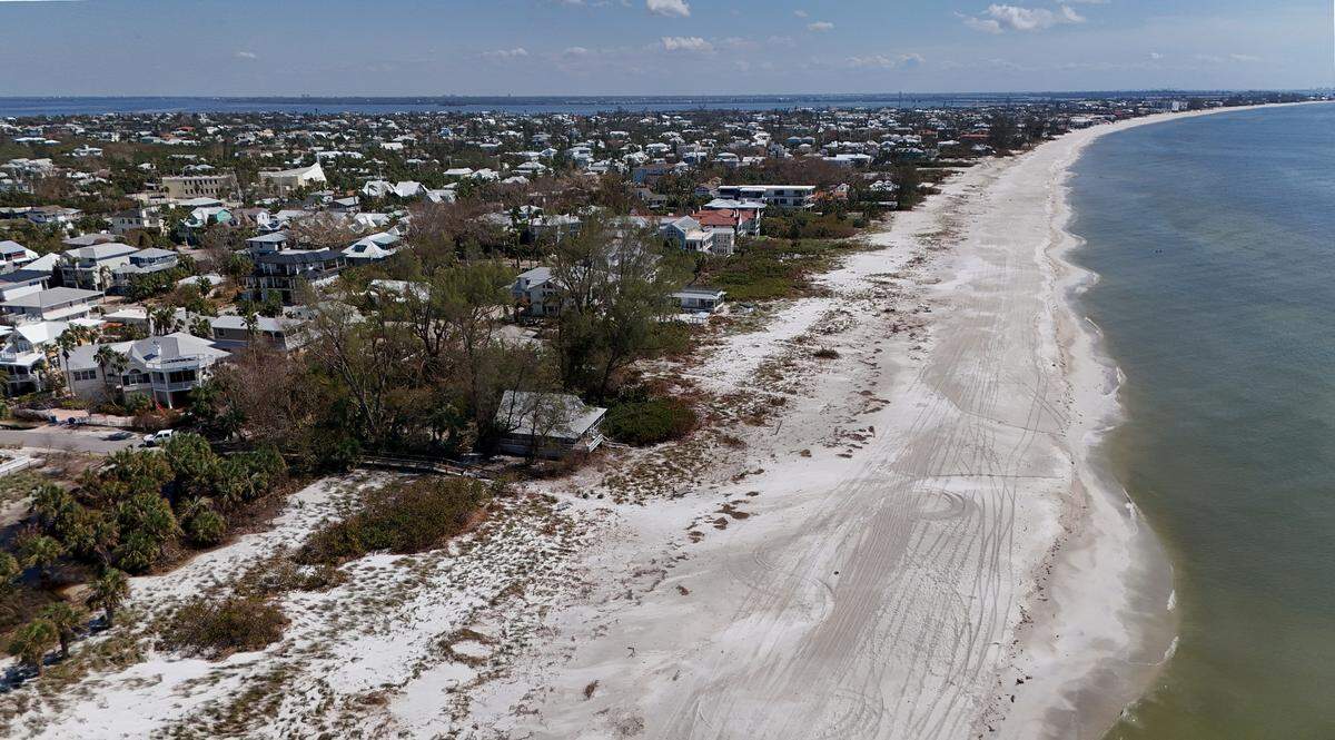 An aerial photo from Oct. 15, 2024, shows how Hurricane Milton’s storm surge ruined sand dunes and sea oats on Anna Maria Island.