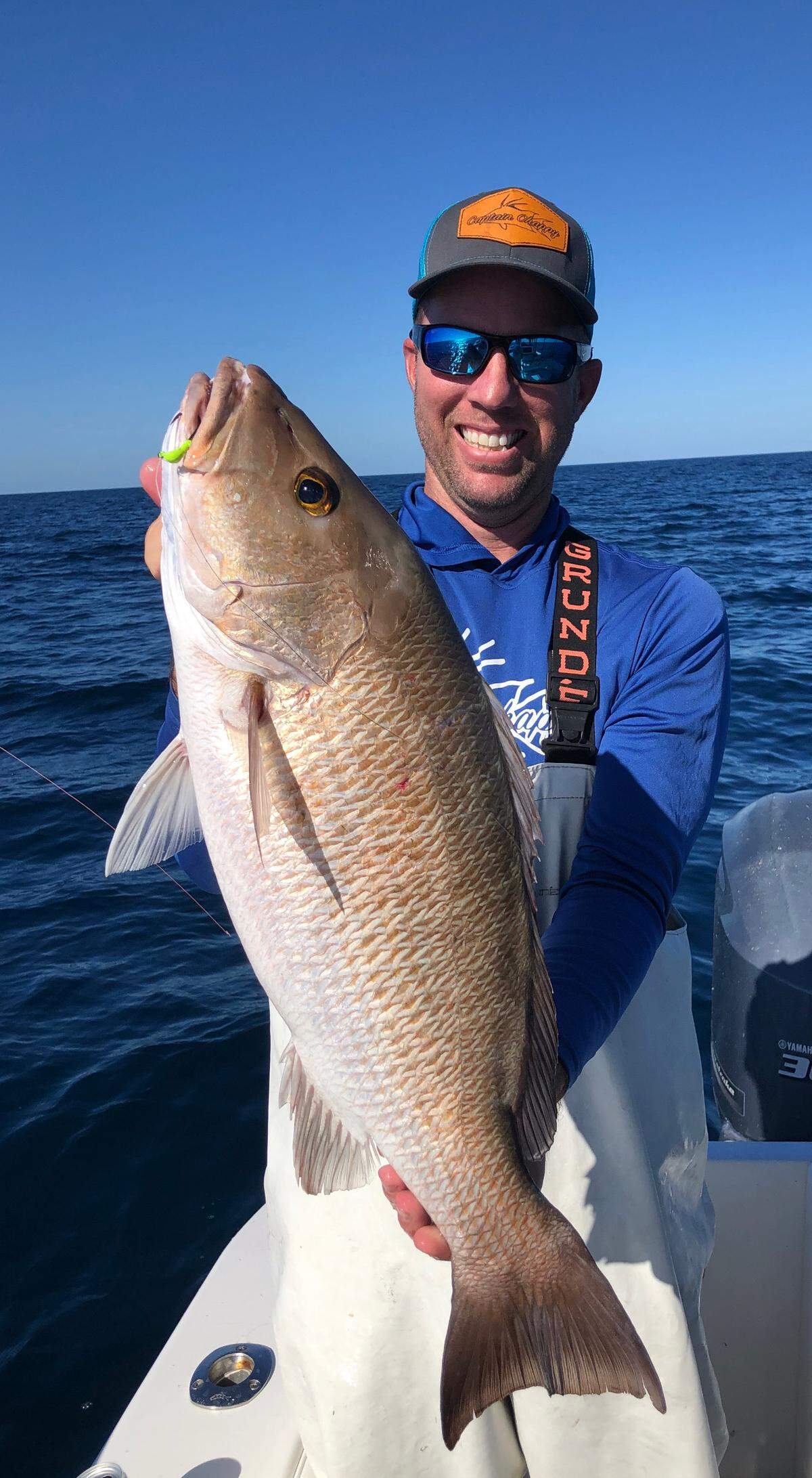 Jon Chapman holds the 28-inch mangrove snapper he caught.