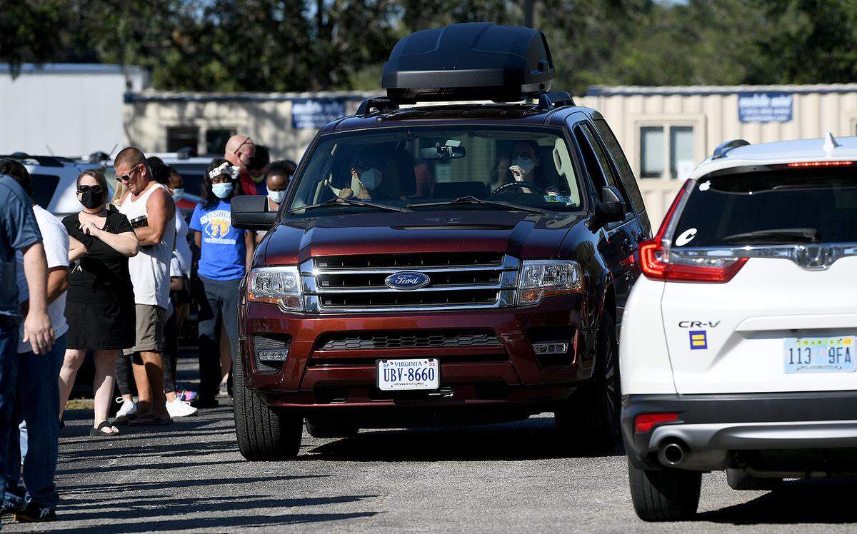 12/28/21—People form a long line at the Bradenton Area Convention Center in Palmetto where COVID-19 testing is ongoing. There were plans to move the site to a smaller location after the New Year, but the center will continue operating until further notice.