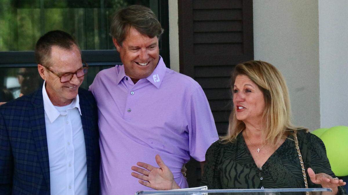 10/11/2021--Two years after the groundbreaking for the Azinger Family Compassion Center, One More Child celebrated the grand opening Monday of the 12,000-square-foot facility designed to serve vulnerable children and struggling families. Shown above are Paul and Toni Azinger, and at left, Jerry Haag, president and CEO of One More Child.