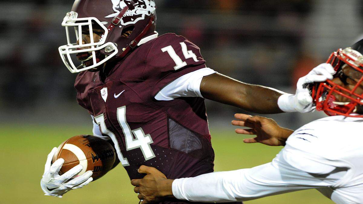 Braden River's Juwaan Jenkins holds off Palmetto's Isyah Funk during last Friday night's game at Braden River. The Pirates remain No. 1 in the Herald's public school power poll. 
 TIFFANY TOMPKINS-CONDIE/Bradenton Herald