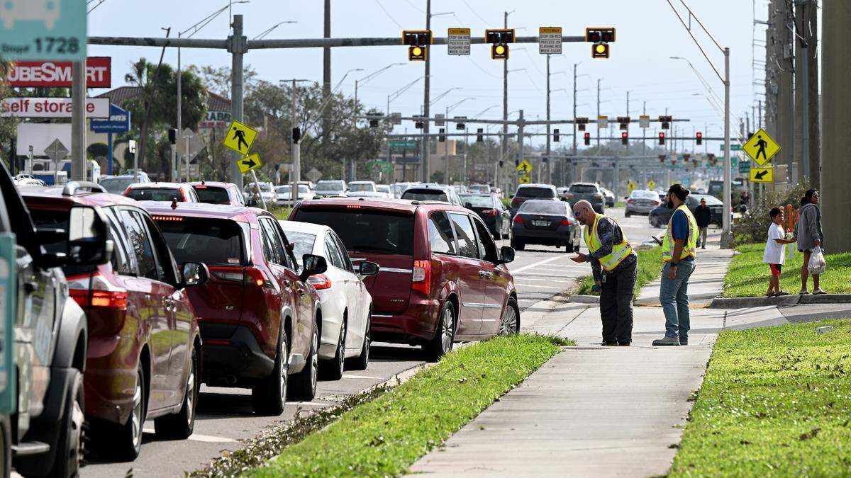 A line of cars formed down the road for the Wawa at 2409 Cortez Road West after Hurricane Milton on Oct. 11, 2024. Only two pumps seemed to be in use as deputies from the Manatee County Sheriff’s Office tried to keep motorists in line.