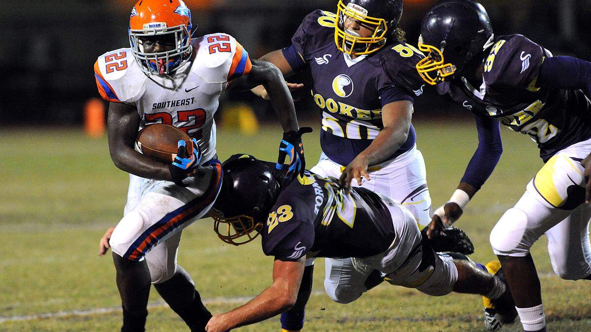 Southeast's Teriq Houston slips away from Booker's defense during their game Friday night against Booker in Sarasota. 
 TIFFANY TOMPKINS-CONDIE/Bradenton Herald