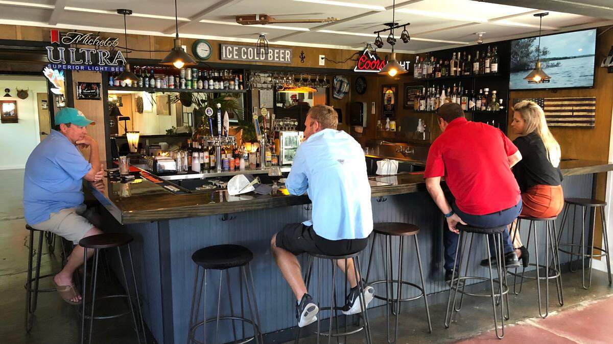 09/21/2021--Customers enjoy a drink at the bar at The Canopy Bistro and Bar at 3505 U.S. Highway 301 in Ellenton.