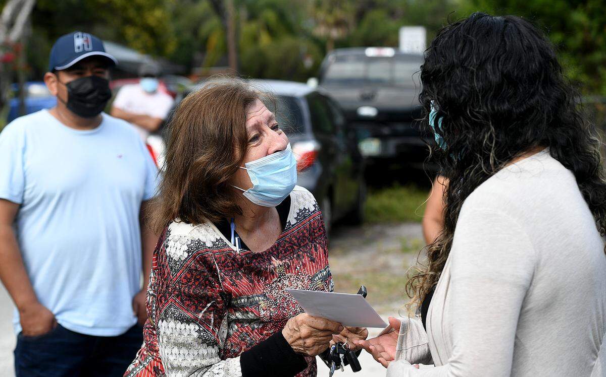 01/15/21--Alaine Chevalier wanted to give her stimulus check to Karina Lopez, right, after her home was destroyed in a gas explosion and fatally wounded her brother, Adrian Lopez, Jr. and wounded her father, Adrian Sr.