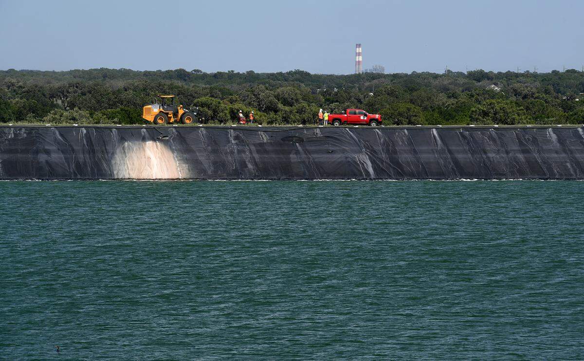 Much has changed at Piney Point, the site where a year ago a discharge and the potential for a collapse of the stack containing contaminated water threatened to collapse. The site has been approved for closure and is under the watchful eye of Herb Donica. A crew works to repair a leak into the liner of New Gypsum Stack South.