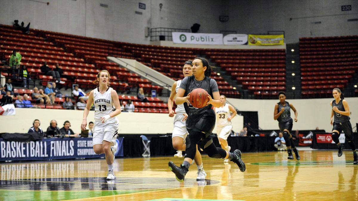 Elise Spiller drives to the basket in Friday's Class 7A state semifinal game in Lakeland. CHARLES A. BAKER III/Speical to the Herald