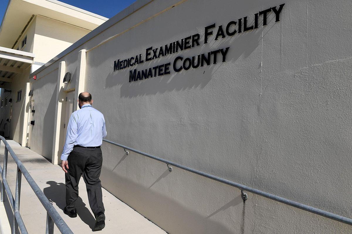 Dr. Russell Vega, District 12 Chief Medical Examiner, enters the medical examiner facility in 2020.