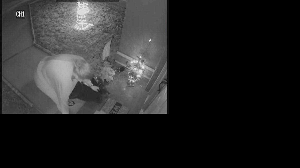 Investigators say Dana Hagar, who is the wife of a law enforcement officer, was seen on surveillance video stealing packages from a neighbor.