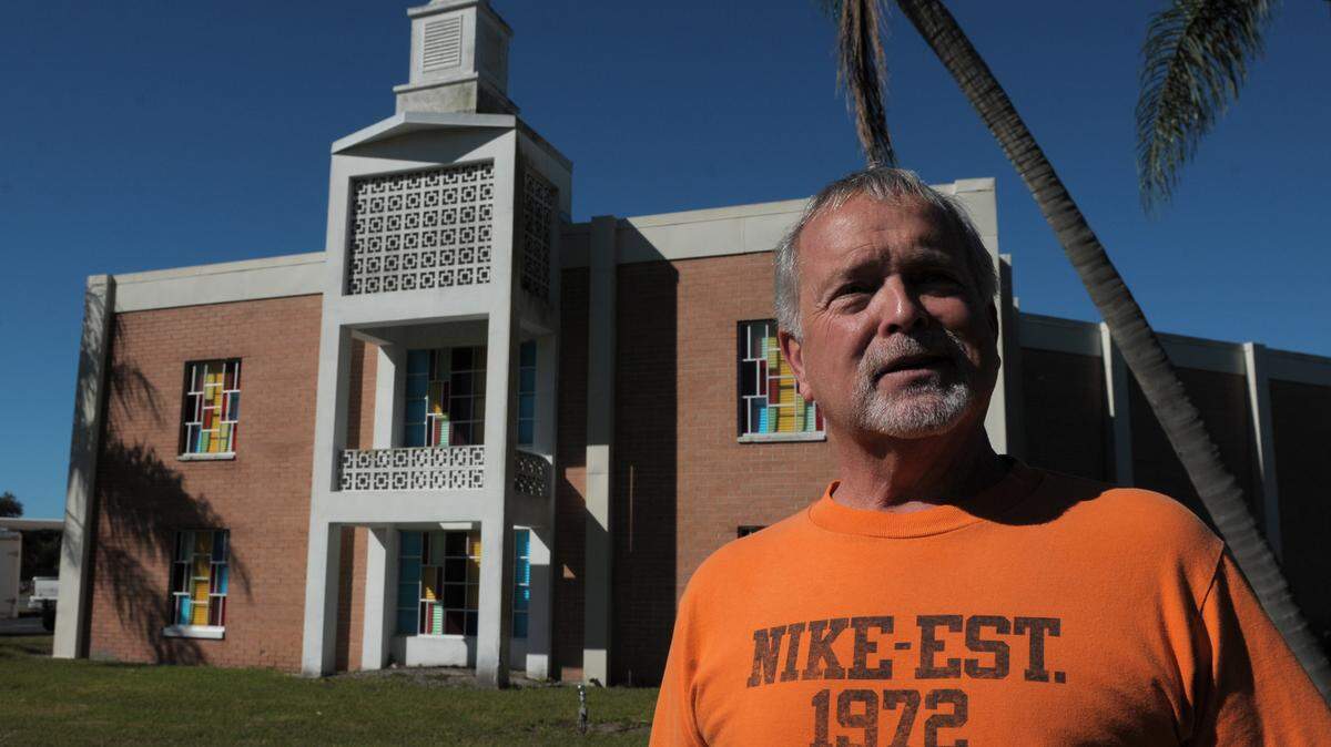 The Rev. Ancil Abney, pastor of The Church at Bradenton, stands in front of the former 43rd Street Church of Christ building. The Church at Bradenton, located next door, recently purchased the property for $1 million. 
 GRANT JEFFERIES/Bradenton Herald