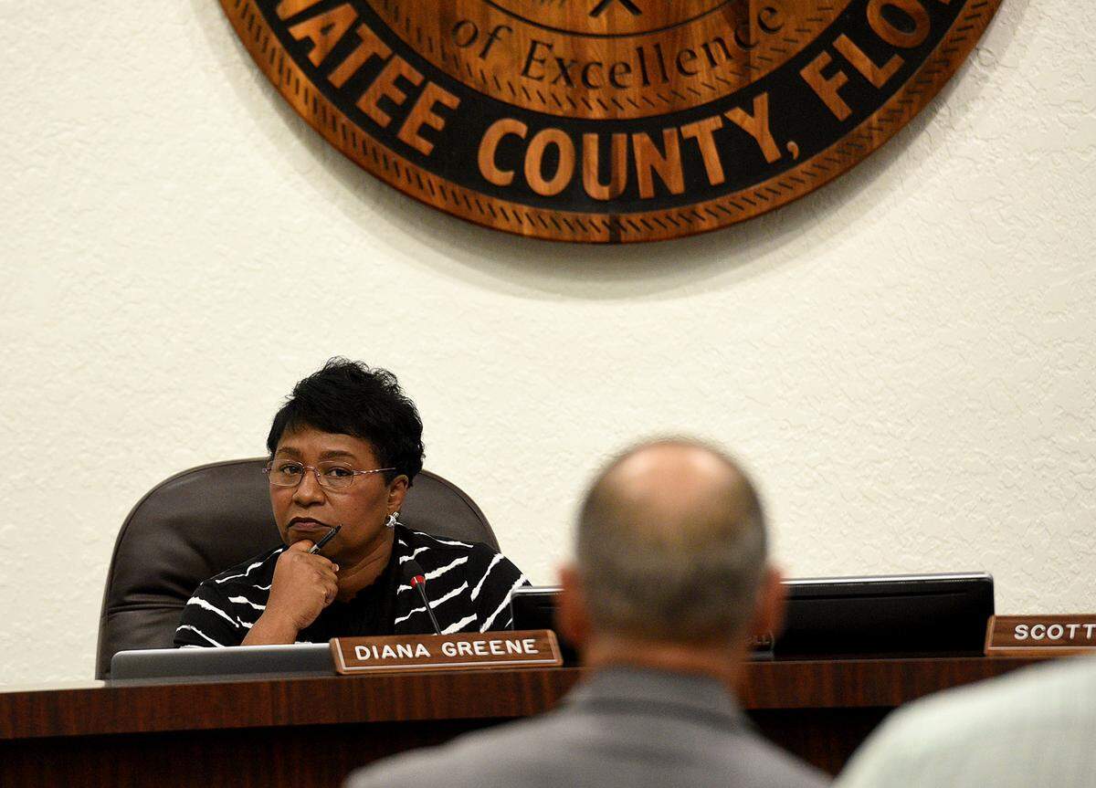 In this file photo, then-Superintendent Diana Greene listens as Ron Ciranna, then a deputy superintendent, speaks during a board meeting. Greene recently said she relied on the expertise of her staff to complete the ERP project.
