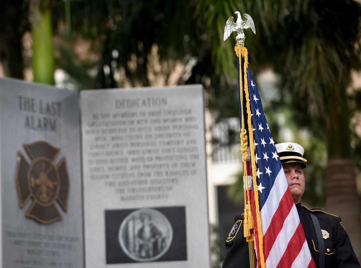A member of the Manatee County Emergency Services color guard at the Tribute to Heroes Memorial Service at Bradenton’s Riverwalk Tuesday morning.