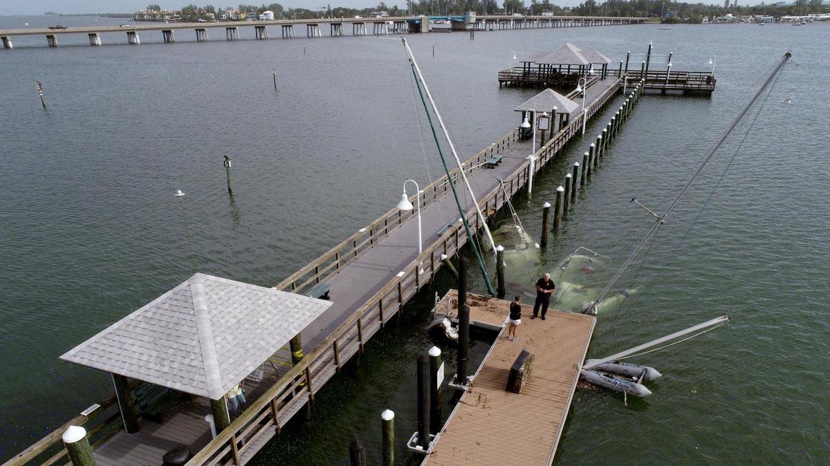 11/12/20--Several boats were partially sunk and damaged, resting near the Bridge Street Pier in the aftermath of Tropical Storm Eta.