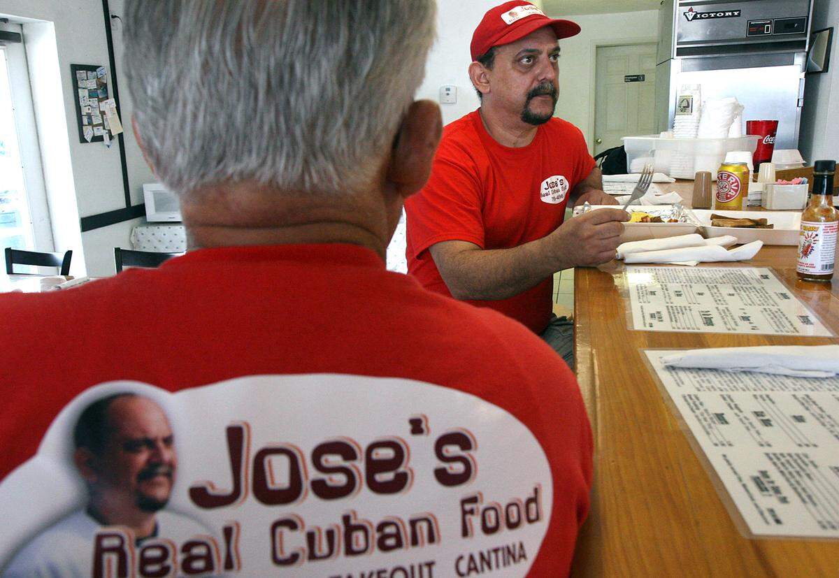 Carlos Baserva watches as his son, Jose Baserva eats his breakfast at Jose’s Real Cuban Food on Cortez Road. Jose Baserva died Friday. File PHOTO BY TIFFANY TOMPKINS-CONDIE/ttompkins@bradenton.com