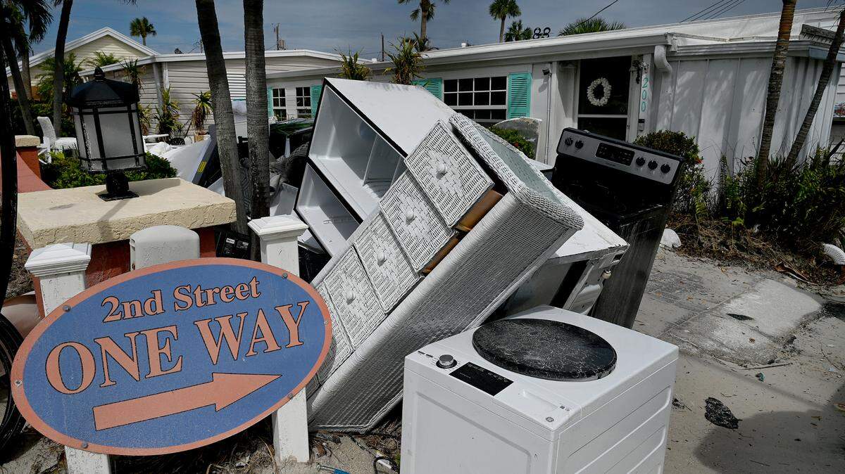 Debris piled high in front of the Sandpiper Resort in Bradenton Beach on Anna Maria Island, Florida, after Hurricane Milton, Oct. 11, 2024.