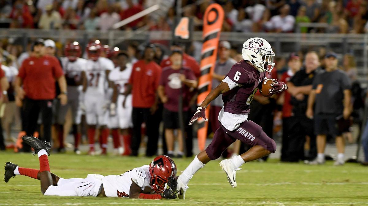 Brian Battie escapes a Palmetto defender to score during Friday night’s game at Braden River.