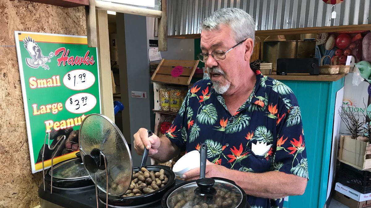 Tim Thompson ladles boiled peanuts at Thompson’s Produce of Cortez. The business is located in a shopping center at 11904 Cortez Road W., between Tyler’s Ice Cream and The Beach Shop.