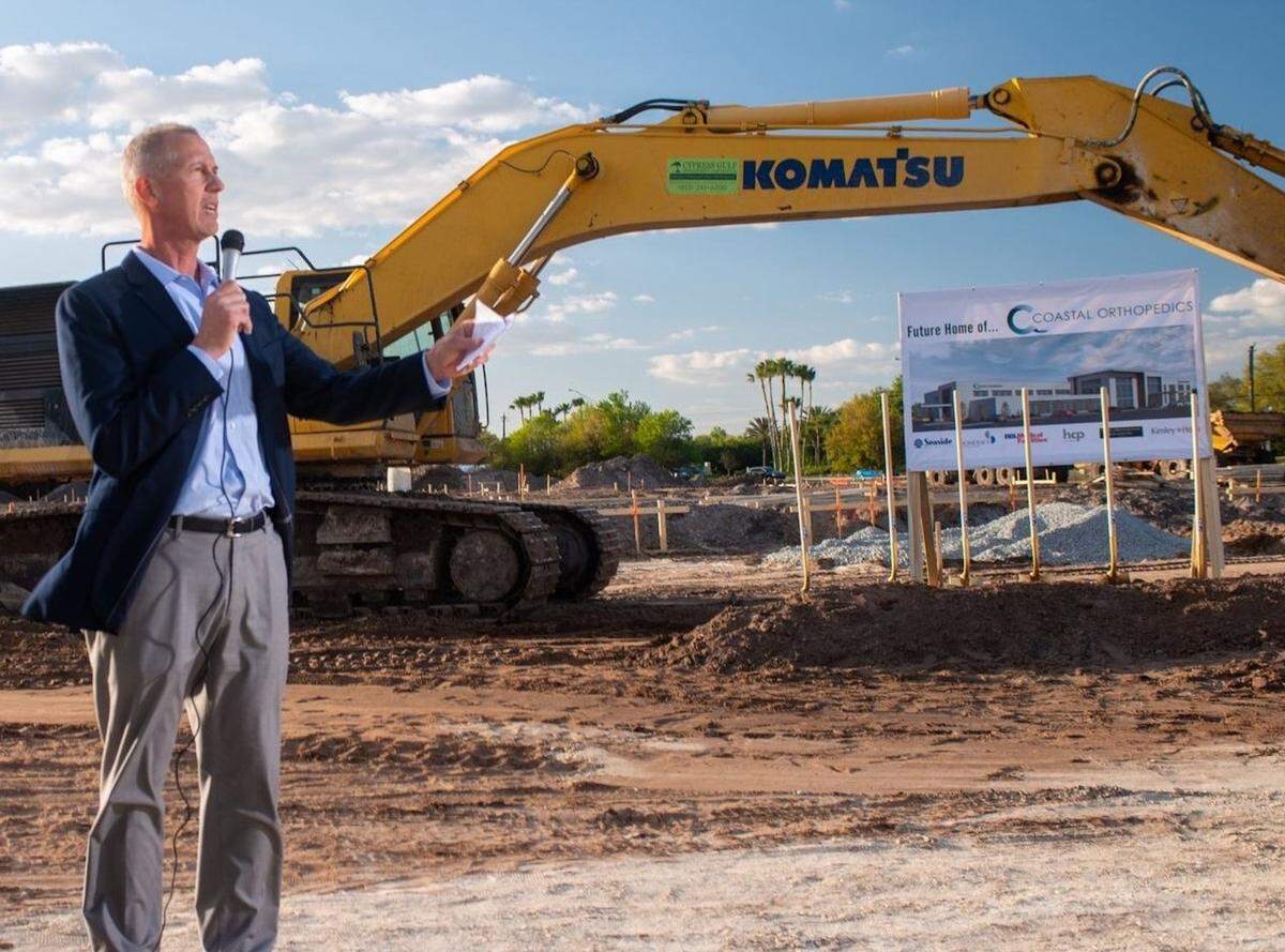 Dr. Arthur Valadie speaks at the groundbreaking for Coastal Orthopedics’ new headquarters building being built east of Interstate 75 on State Road 64 East at Lena Road.