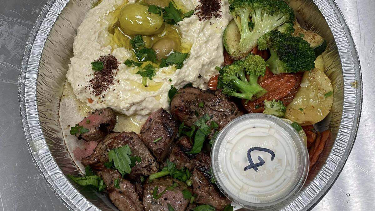 Chef Sam Abbo and Tracy Kennedy recently opened Sammy’s Mediterranean Kitchen at 5337 Gulf Drive, Suite 300, in Holmes Beach. Shown above is the lamb kebab plate.