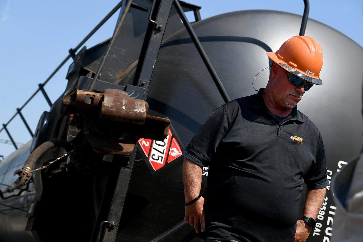 A worker with Seminole Gulf Railway at the site of a derailment that happened on Feb. 28th in Manatee County; one of the cars carrying 30,000 gallons of propane came off the tracks and was on its side.